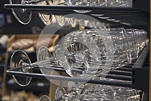 Glasses and bottles on a rack in the wine cellar