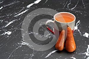 Glasses of carrot juice with vegetables on table close up