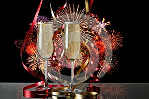 Glasses of champagne for celebrations with fire works background.