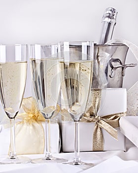 Glasses of champagne and gifts