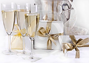 Glasses of champagne and gifts