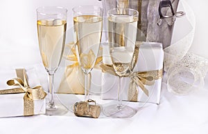 Glasses of champagne and gifts
