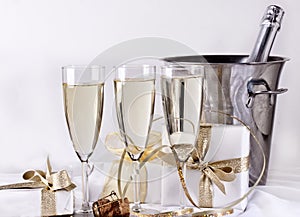 Glasses of champagne and gifts