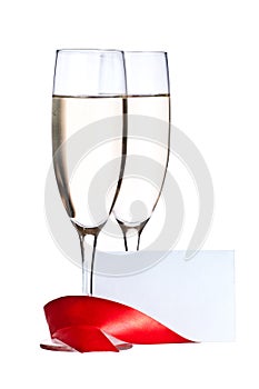 Glasses with Champagne and invitation card