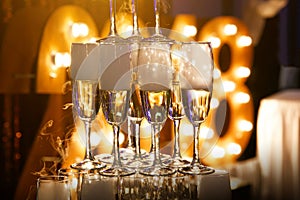 Glasses of champagne made in a pyramid for event party or wedding ceremony