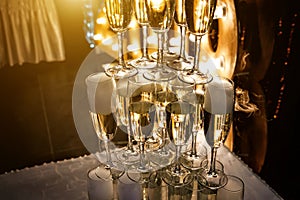 Glasses of champagne made in a pyramid for event party or wedding ceremony