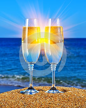 Glasses with champagne near the sea