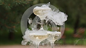 Glasses Of Champagne Smoking. Champagne glasses. Smoke Billowing Over A Champagne Flute. Catering service. Wedding slide