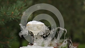 Glasses Of Champagne Smoking. Champagne glasses. Smoke Billowing Over A Champagne Flute. Catering service. Wedding slide photo