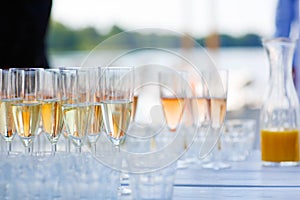 Glasses with champagne and wine on summer wedding