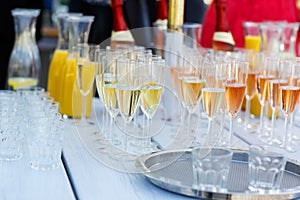 Glasses with champagne and wine on summer wedding