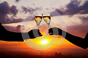 Glasses with champers at sunset