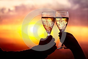 Glasses with champers at sunset
