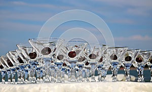 Glasses with cherries on the table