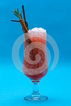 Glasses of cocktails on blue background