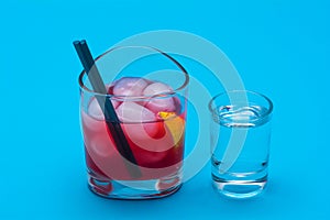 Glasses of cocktails on blue background