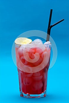 Glasses of cocktails on blue background