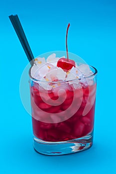 Glasses of cocktails on blue background