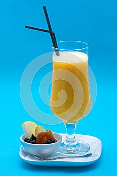 Glasses of cocktails on blue background
