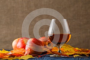 Glasses of cognac on table. It serves fruit brandy.