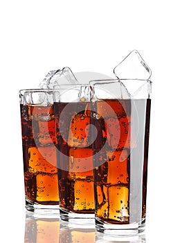 Glasses of cola soda drink cold with ice cubes