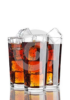 Glasses of cola soda drink cold with ice cubes