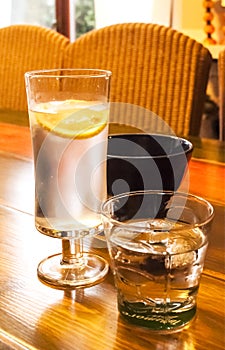Glasses with cold drinks on table