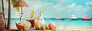Glasses with cold refreshing summer drinks. Ice lemonade, tea, smoothie and tropical fruits on sand beach over sea with boats and