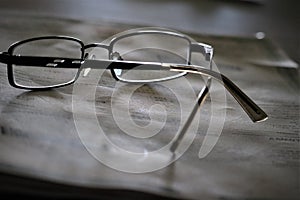 glasses composition with newsletter photo