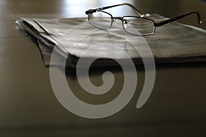 glasses composition with newsletter photo