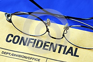 Glasses on the confidential envelope