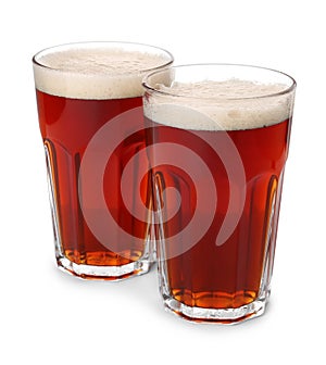Glasses of delicious kvass on background