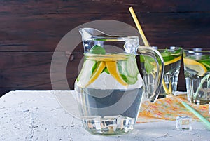 Glasses with detox fresh organic cucumber, lemon and mint water