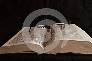 Glasses on dictionary