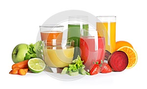 Glasses with different juices and fresh fruits and vegetables on white