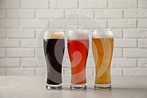 Glasses with different types of cold tasty beer