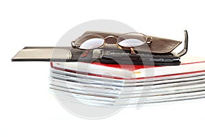 Glasses eBook reader pile of books, isolated