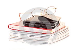 Glasses eBook reader pile of books, isolated