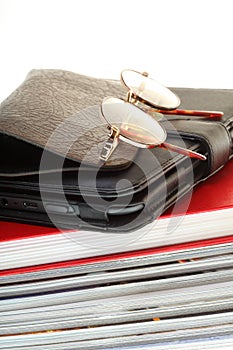 Glasses eBook reader pile of books, isolated