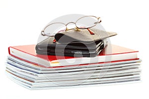 Glasses eBook reader pile of books, isolated on white