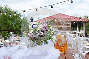 Glasses on the festive table setting. Wedding table decor concept. Table setting in classic style, setout. fine art.