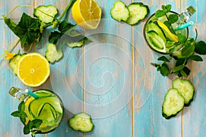 Glasses with fresh organic Cold and refreshing infused detox water with lemon and cucumber