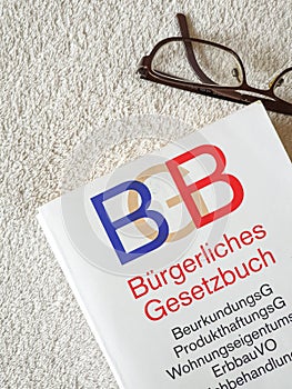 glasses and a german BGB book