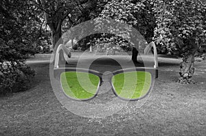 Glasses with green color in it on grey lawn background in York,