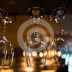 Glasses hanging over bar rack