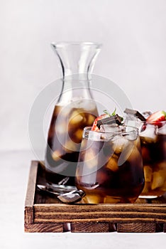 Glasses of Homemade Cold Brew Coffee to Drink for Breakfast on Wooden Tray Summer Beverage with Ice Cubes Decorated with