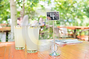Glasses of homemade lemonade on restaurant garden patio table