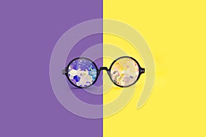 Glasses kaleidoscopes hologram. Points are located frontally on a purple-yellow