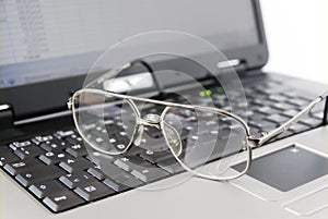 Glasses and laptop