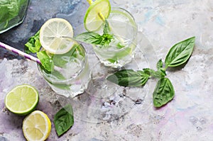 Glasses of lemonade with basil and mint